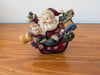 Santa and Child in Sleigh Figurine from Unknown -  Holiday Decor (Resin Figurine / Ornament, Whimsical, Folk Art, Red, Brown, Blue)